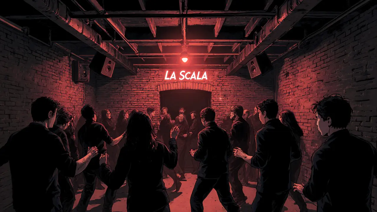 La Scala underground club with a red light entrance and crowd dancing to vinyl house music in dim industrial space.