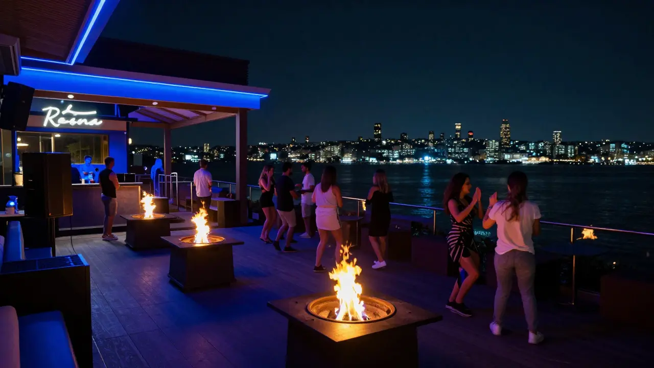 Reina nightclub's outdoor terrace with fire pits and Bosphorus views at night